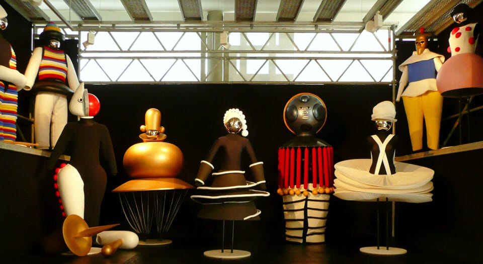 a collection of modern costumes on mannequins