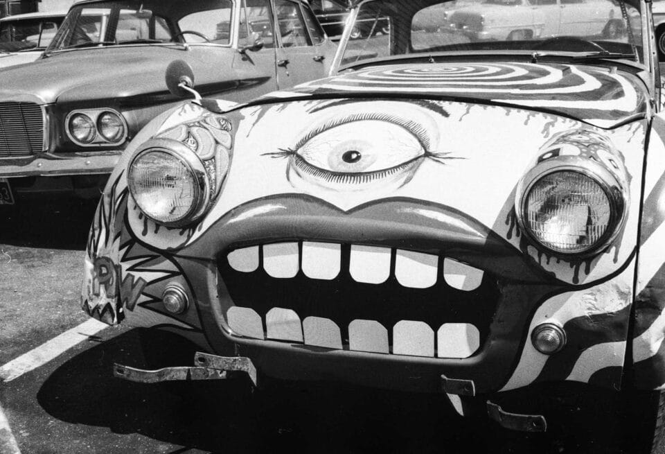 a black and white imager of a car painted like a face